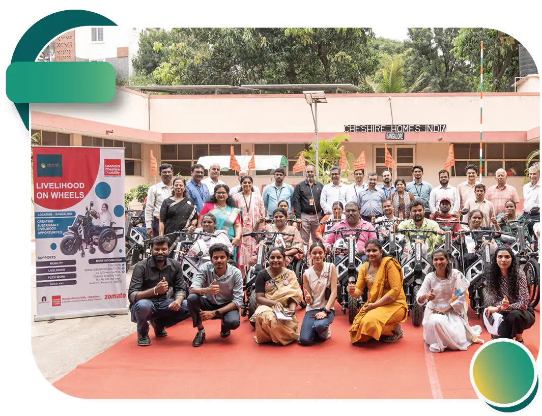 Beneficiaries posing with specially designed mobility vehicles